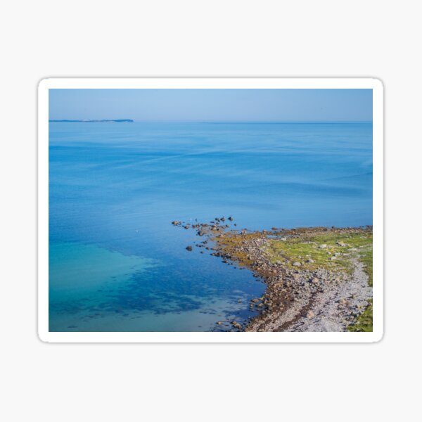Coastlines frame the blue sea Sticker