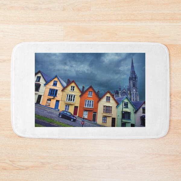 Item preview, Colorful Rowhouses in Cobh, Ireland with Cathedral Looming in Background designed and sold by Greg Hess.