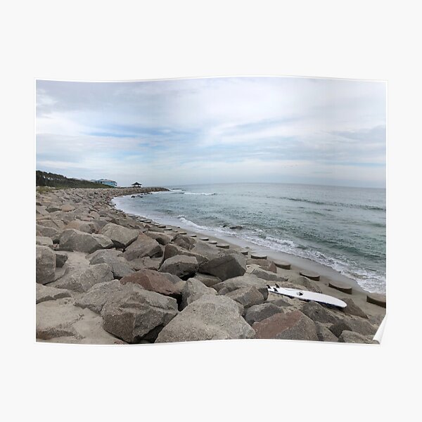 Surfboard On The Rocks Poster