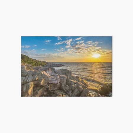 Stunning sunset over ocean and cliffs Art Board Print