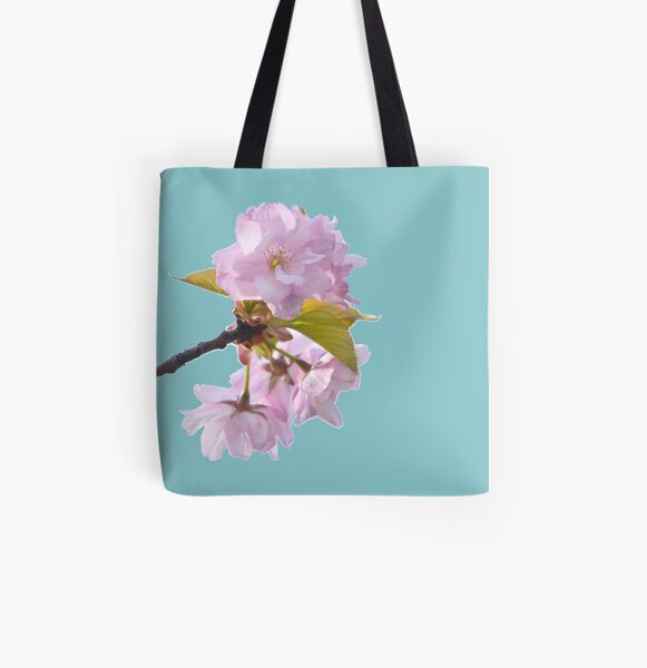Beautiful pink cherry blossom in full bloom with turquoise blue background - the power of flowers. All Over Print Tote Bag
