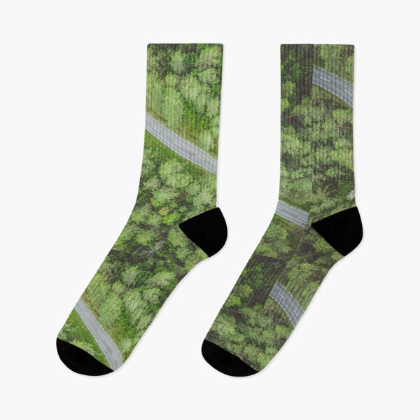 Item preview, Empty road going diagonally through the forest top down aerial view designed and sold by Lukasz Szczepanski.
