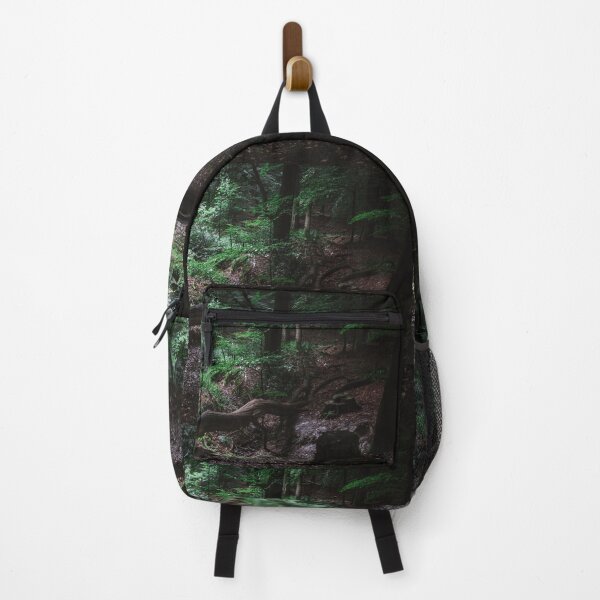 Deep in the woods lies a fallen tree Backpack