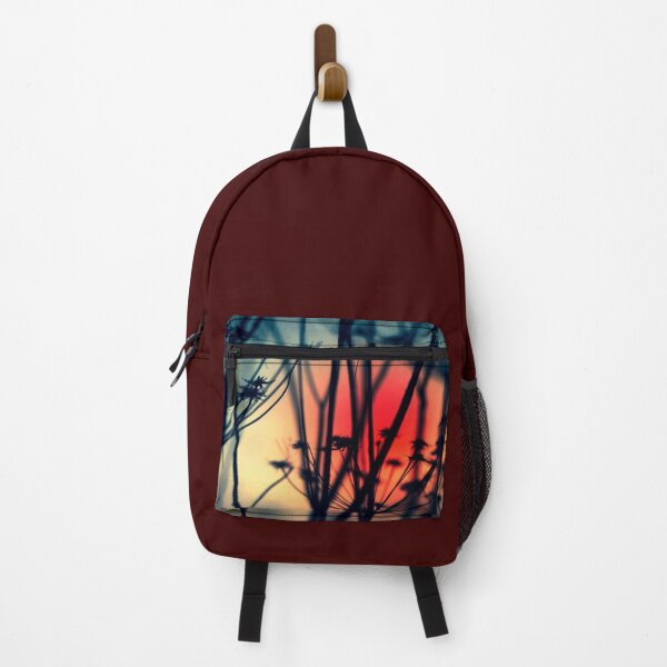 Item preview, Shapes of Decay - Silhouettes of dry Weeds against colourful lights designed and sold by Dyrk Wyst Redbubble Shop.