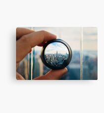 Man holding a lens over Manhattan Metal Print