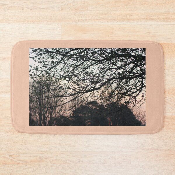 Item preview, silhoutted trees on a peachy pink salmon and light blue sky. Sunset through the trees designed and sold by Emma  Amies.