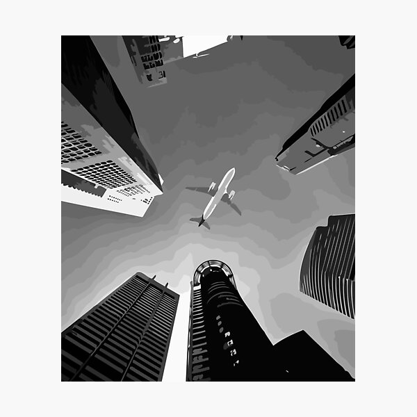 Airplane flying over the city Photographic Print