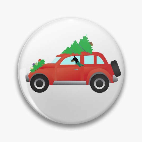 Doberman Pinscher Driving a Red Car with a Christmas Tree on Top Pin