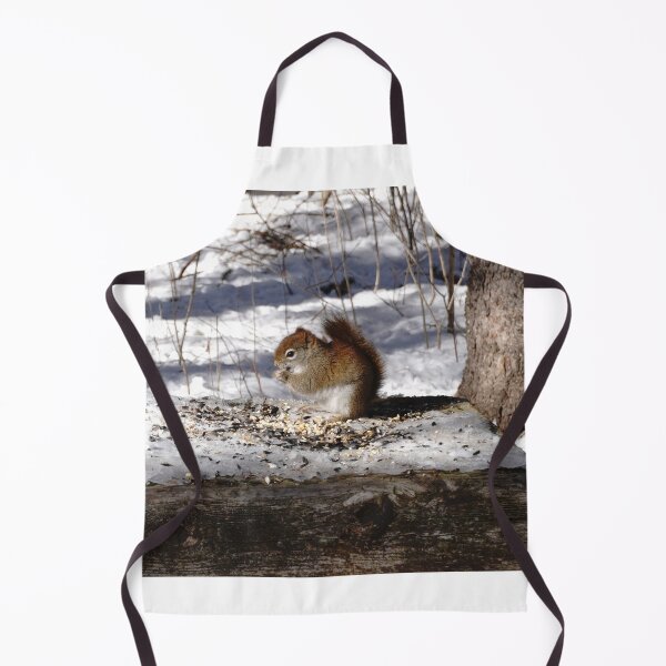 Item preview, Tiny red squirrel eating seeds on a snowy woodland trail designed and sold by cuisinecat2.