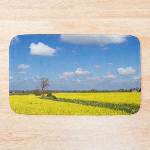 Item preview, Oilseed Rape Field in the Cotswolds near the village of Stanton, England, on a beautiful blue sky and sunny day.  designed and sold by Cameranick.