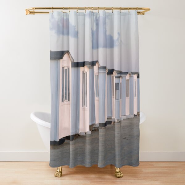 White beach huts on the golden sand at sun set Shower Curtain