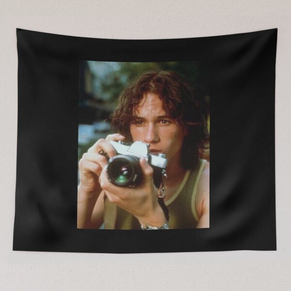 Item preview, heath ledger with vintage camera black background designed and sold by molithesecond.
