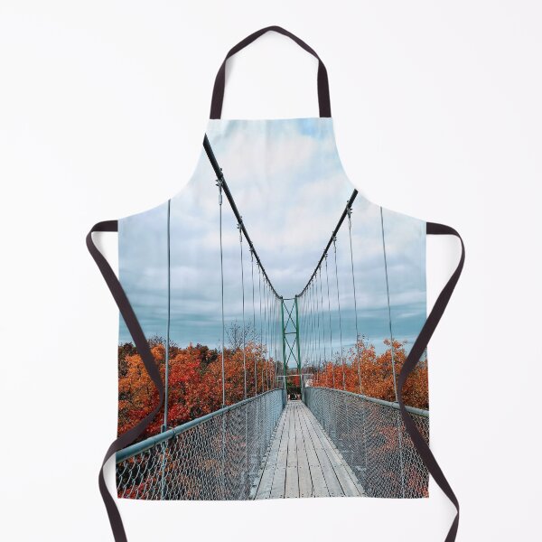 Item preview, Puente colgante sobre el bosque. Paisaje otoñal con hojas rojas, cielo gris y puente en Scenic Caves, Collingwood, Ontario designed and sold by milkasweet.