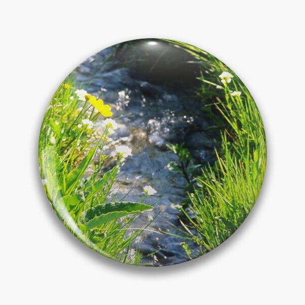 Item preview, Gently babbling brook meandering through a bright green field with summer wild flowers. Close up. designed and sold by JellyBeenzz.