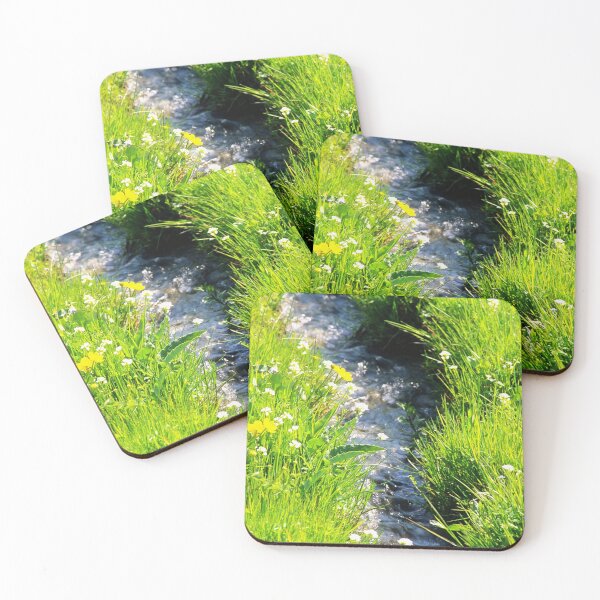 Item preview, Gently babbling brook meandering through a bright green field with summer wild flowers. Close up. designed and sold by JellyBeenzz.