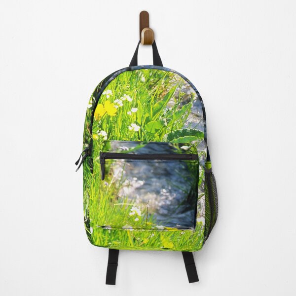 Item preview, Gently babbling brook meandering through a bright green field with summer wild flowers. Close up. designed and sold by JellyBeenzz.