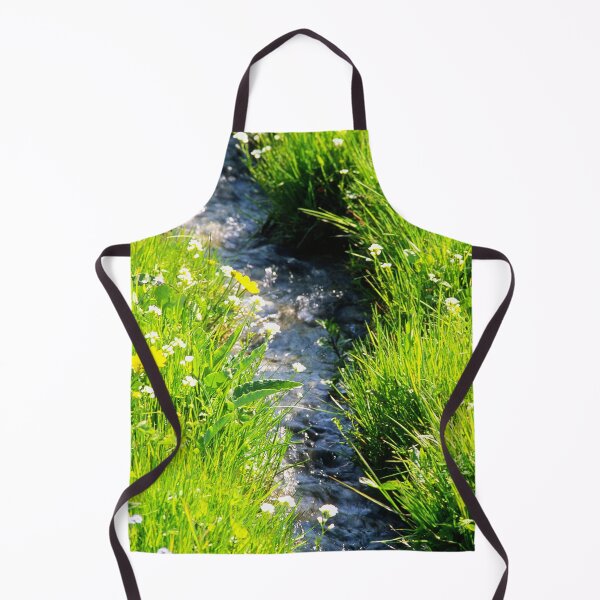 Item preview, Gently babbling brook meandering through a bright green field with summer wild flowers. Close up. designed and sold by JellyBeenzz.