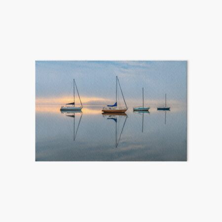 Clouds, boats and reflections on a foggy morning Art Board Print