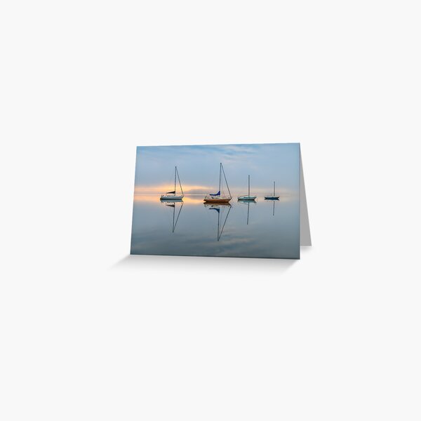 Clouds, boats and reflections on a foggy morning Greeting Card