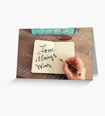 Motivational concept with handwritten text LOVE ALWAYS WINS Greeting Card