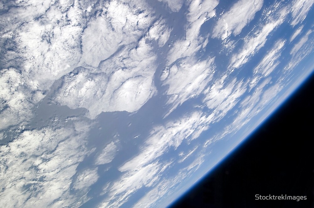 "A blue and white part of Earth and the blackness of space viewed from ...