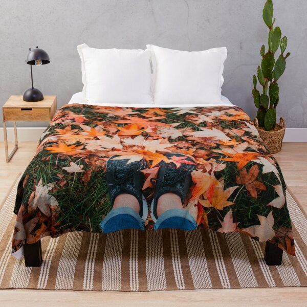 Item preview, A pair of cute feet covered by orange autumn leaves designed and sold by Carmen Jost.