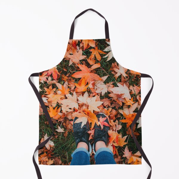 Item preview, A pair of cute feet covered by orange autumn leaves designed and sold by Carmen Jost.