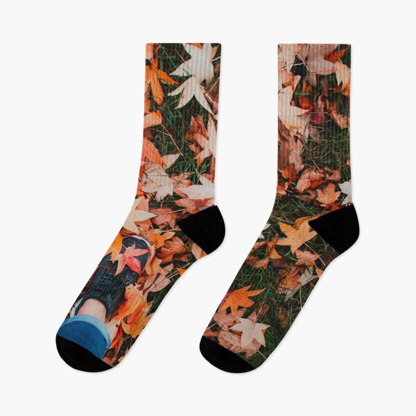 Item preview, A pair of cute feet covered by orange autumn leaves designed and sold by Carmen Jost.