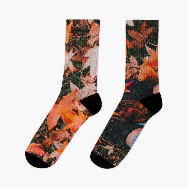 Item preview, Vertical shot of a pair of cute feet covered by orange autumn leaves designed and sold by Carmen Jost.