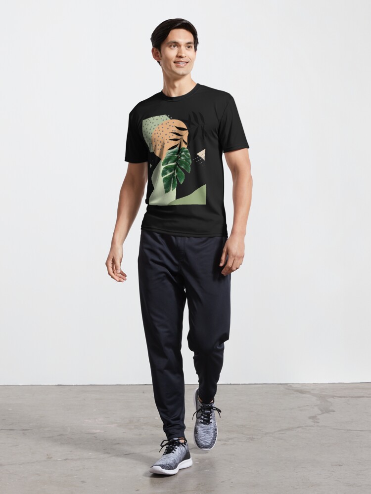 Imagen 5 de 7, Camiseta deportiva con la obra Arte abstracto tropical Monstera con formas suaves en cálidos tonos terrosos con hojas verdes I, diseñada y vendida por AbstractTrace.