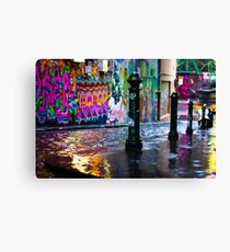 Bollards in a Rainy Graffiti Lane Canvas Print