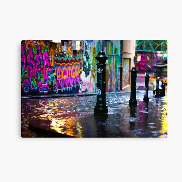 Bollards in a Rainy Graffiti Lane Canvas Print