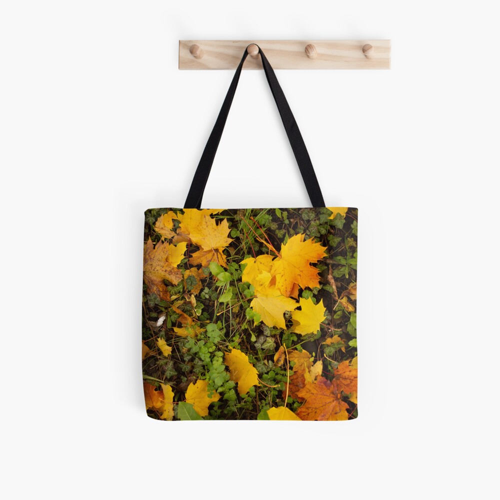 Autumn leaves in oranges and reds and greens. Fall colors Tote Bag