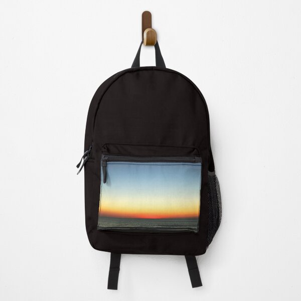Item preview, Beautiful blue skies with yellow-reddish sunset over ocean designed and sold by Vero De.