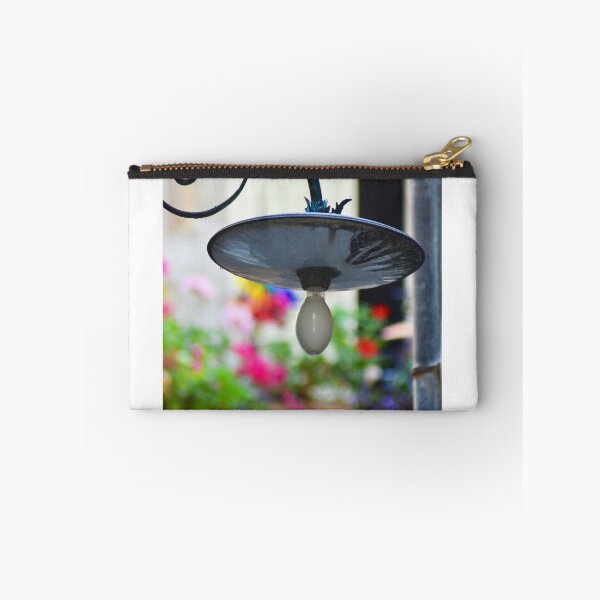 Item preview, An old black light hanging over colourful flowers. designed and sold by EAnneH.