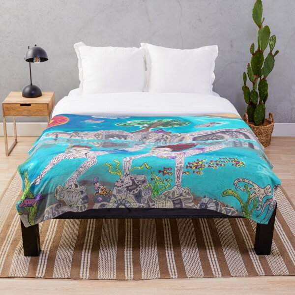 Snorkeling in the blue sea Throw Blanket