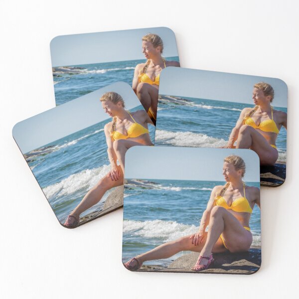 Item preview, Beautiful fitness girl on the rocks at the seashore posing designed and sold by Ninnudez.