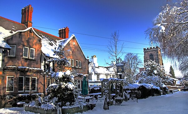 Snowfall in Grappenhall Village, festive winter scene,Warrington, Cheshire, England