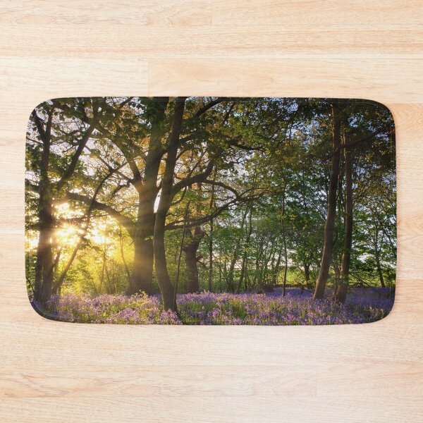 Item preview, Sunrise in bluebell woods in Norfolk UK designed and sold by simonbratt.