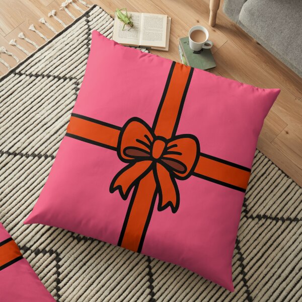 Festive Red Gift Bow on Pink Floor Pillow