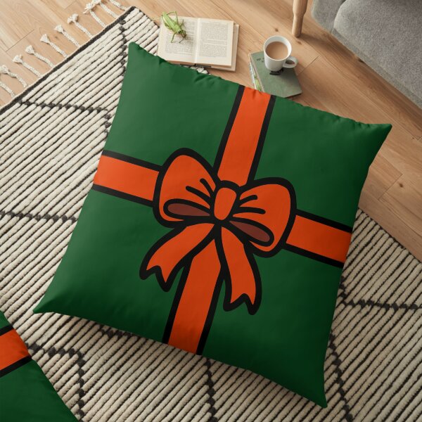 Festive Red Gift Bow on Green Floor Pillow