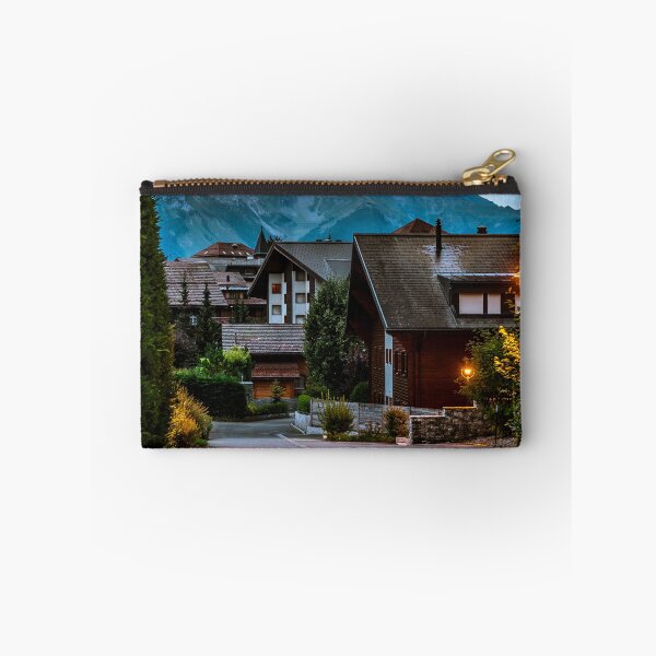 Item preview, Evening street view in a small Swiss village. The high Alps in the background seem to be drawn. designed and sold by Alexander Sorokopud.