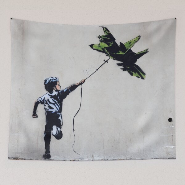 Item preview, BANKSY Boy Playing With Jetfighter Kite - Street Art Ukraine designed and sold by WE-ARE-BANKSY.