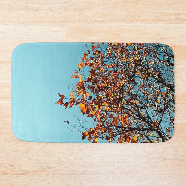 Item preview, Orange autumn tree leaves with blue sky background designed and sold by Mrvell.