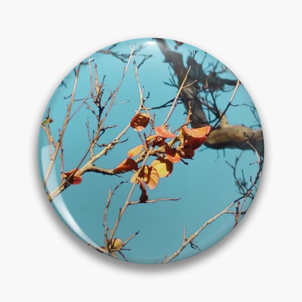Item preview, Tree branch with orange autumn leaves and blue sky designed and sold by Mrvell.