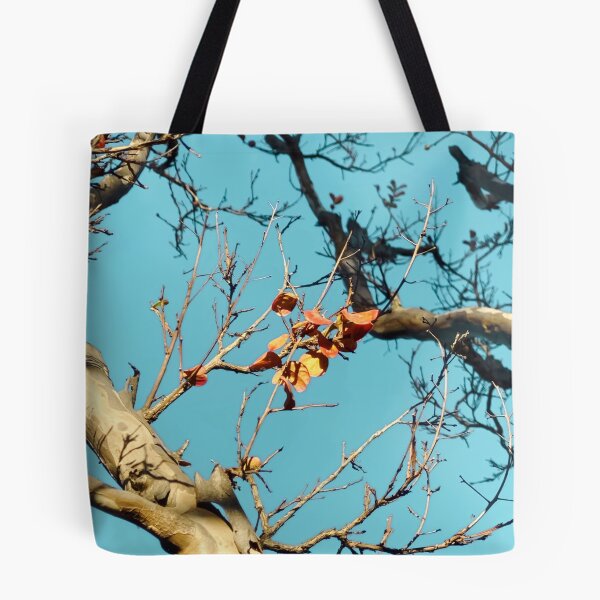 Item preview, Tree branch with orange autumn leaves and blue sky designed and sold by Mrvell.