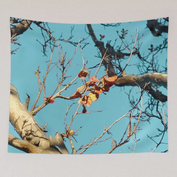 Item preview, Tree branch with orange autumn leaves and blue sky designed and sold by Mrvell.