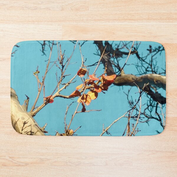 Item preview, Tree branch with orange autumn leaves and blue sky designed and sold by Mrvell.