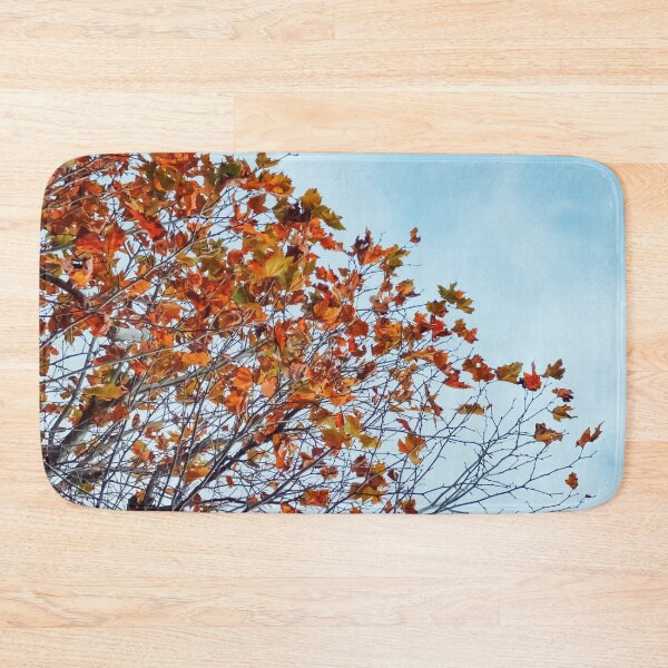 Item preview, Tree branch with orange autumn leaves and blue cloudy sky designed and sold by Mrvell.