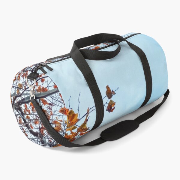 Item preview, Tree branch with orange autumn leaves and blue cloudy sky designed and sold by Mrvell.